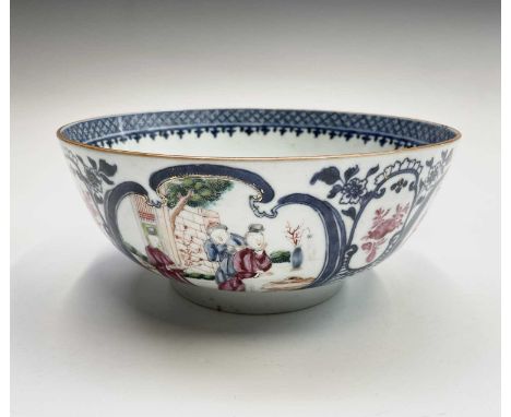 A Chinese porcelain famille rose bowl, Qianlong, decorated with blue cartouches enclosing figures including a lady playing a 