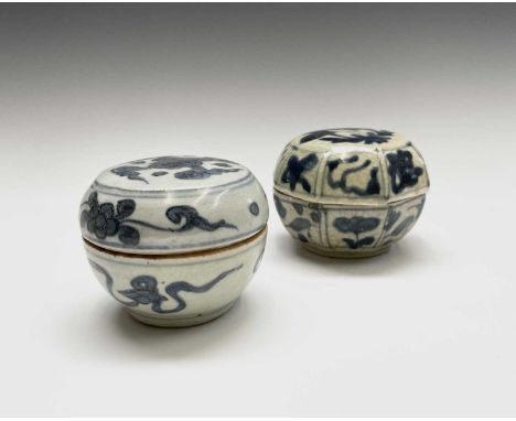 Two Chinese pottery blue and white jars and covers, probably Ming Dynasty, heights 7cm, diameter 9.5cm.Provenance:Michael Tre