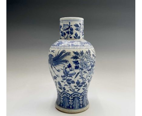 A Chinese porcelain blue and white baluster vase, 19th century, decorated with flowering branches and phoenix, height 40cm, w