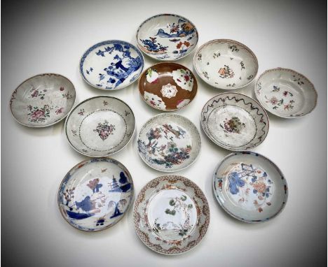 A selection of twelve Chinese porcelain saucer dishes, 18th and 19th century, largest diameter 13.7cm.Provenance:Michael Tret