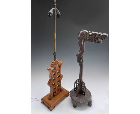 A Chinese hardwood extended table lamp, mid 20th century, fully extended height 92cm, width 25cm and a Chinese gong stand, he