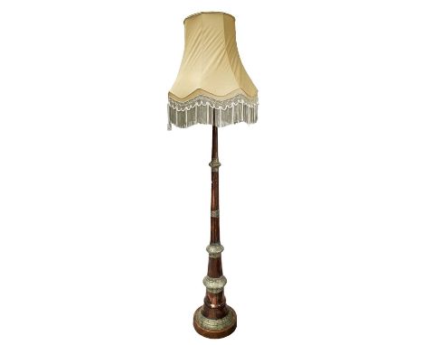 An Indian copper and white metal standard lamp, early 20th century, mounted on a circular wooden plinth, total height includi