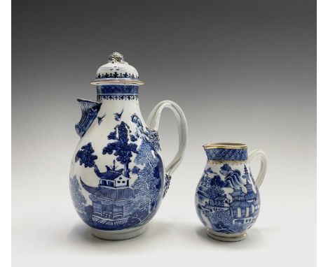 A Chinese Export porcelain blue and water water jug, Qianlong period, height 24cm and a similar cream jug, height 12cm.Proven