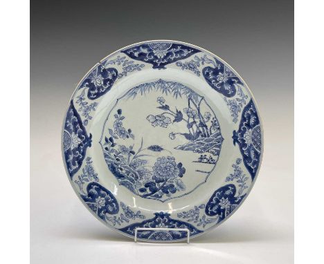 A Chinese Export porcelain blue and white charger, 18th century, with bamboo, chrysanthemum and further foliage, diameter 38c