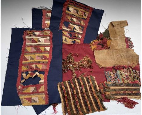 A Pre Columbian Peruvian fragment, approx 500 AD, originally part of a cloak, together with other early textile fragments.