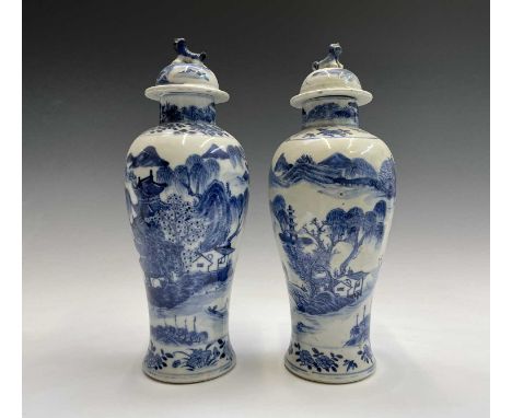 A pair of Chinese porcelain blue and white vases, late 19th century, four character Kangxi mark, each with a river scene, pag