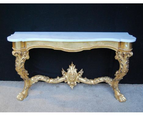 Marble topped giltwood console table, the serpentine top over beaded frieze, acanthus cabriole legs terminating in paw feet u