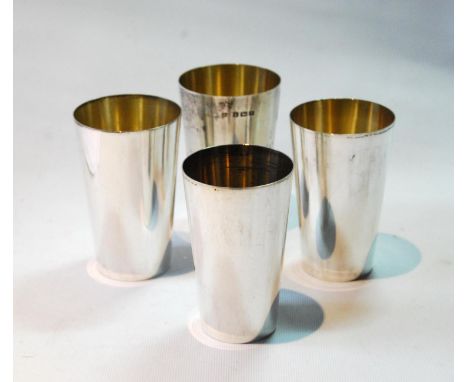 Nest of four silver hunting beakers of plain tapering shape with gilt interiors, Birmingham 1923, 10.2cm, 16oz. 