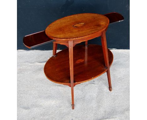 Edwardian kettle stand, the crossbanded oval top with shell inlay over opposing slides, raised on square tapering legs termin