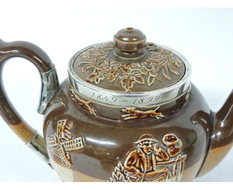 A Royal Doulton three piece teaset, Harvest Rouge, with windmill, hunting etc, silver mounts