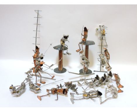 A collection of character frogs, titled 'The Suitors', two handcrafted, beaten and sculpted character frogs climbing up a lad