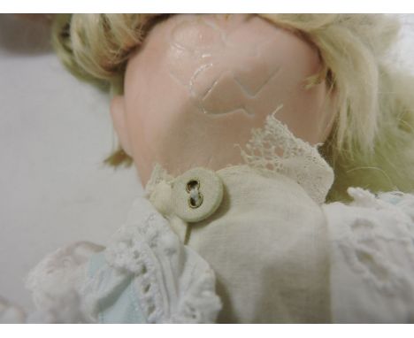 A William Goebel bisque head doll, with open mouth and eyes unfixed, and another composition shoulder head doll, probably by 