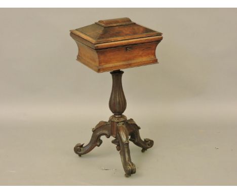 A Victorian rosewood work table, with tripod base