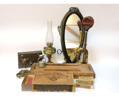 A horse yoke mirror, a brass car horn, a converted oil lamp, a lion mask knocker, lock, chronostamp, cigar press, etc