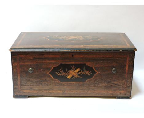 A late 19th century Swiss music box, with inlaid rosewood case and playing eight tunes, with 13in cylinder, striking on nine 