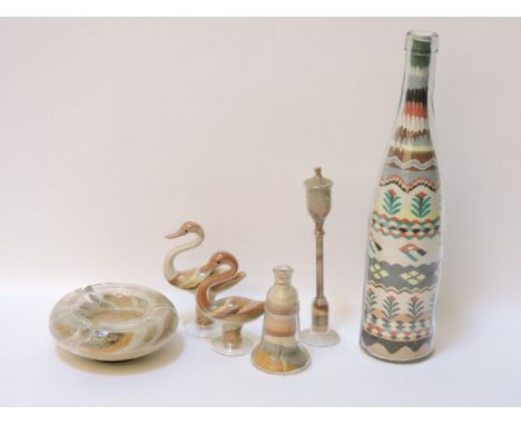 Six coloured sand filled glass items, including a bottle, lamp post, and two birds, tallest 32cm