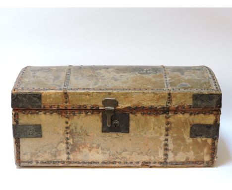 A pony hide trunk, with a dome top, the interior with printed paper, with iron carrying handles, 70cm wide