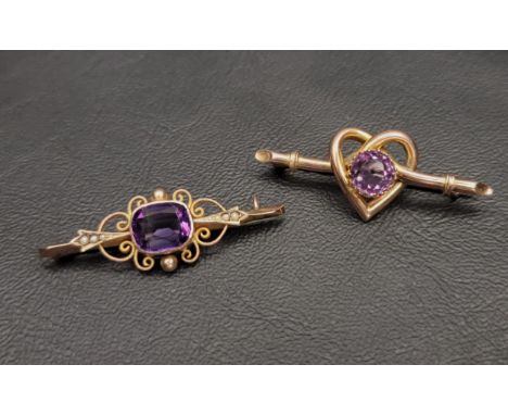 TWO VICTORIAN AMETHYST SET NINE CARAT GOLD BROOCHESone with central amethyst in pierced scroll surround and flanked by seed p