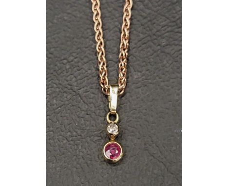 NINE CARAT ROSE GOLD NECKCHAINwith a diamond and ruby pendant, approximately 4.8 grams 