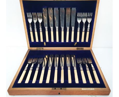 ELKINGTON & CO SET OF FISH CUTLERYcomprising twelve fish knives and forks with ivorine handles, in a fitted oak canteen with 
