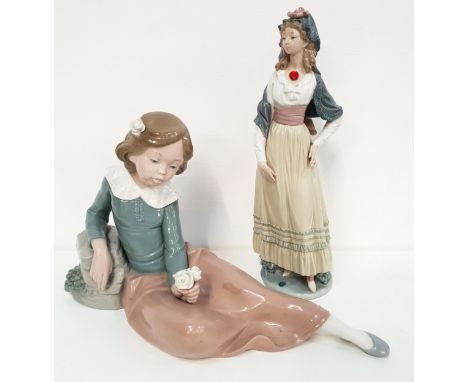 LLADRO GOYA LADY FIGURINEwearing a shawl and long skirt, impressed to base C18 JU, 32cm high, together with a Nao figurine of