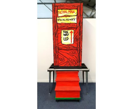 MAGICIAN'S ILLUSION STAGE PROPS comprising a set of disappearing stairs, painted in red and green and on wheels, 75cm high x 