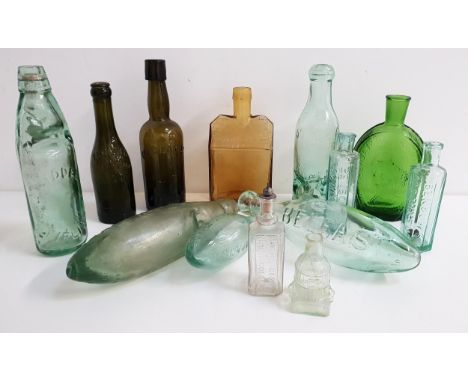 SELECTION OF VINTAGE GLASS BOTTLEScomprising three torpedo bottles marked 'Corry Belfast', 'P.Sullivan Beaconsfield' and 'Kin