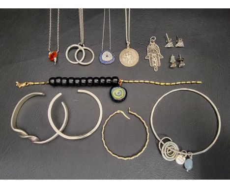 SELECTION OF SILVER JEWELLERYincluding cuff bracelets, pendants on chains, stud earrings, a bangle with charms, pendant, and 