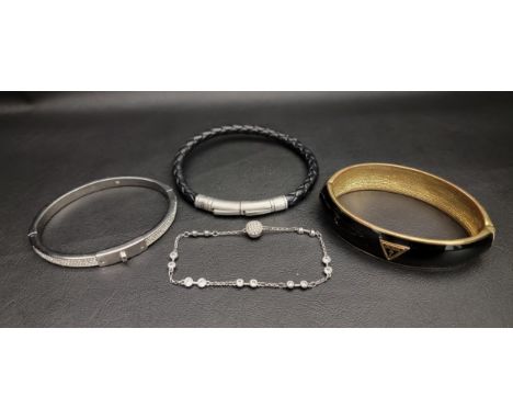 SELECTION OF FASHION JEWELLERYcomprising a Guess hinge bracelet, a Fossil leather bracelet, a Michael Kors CZ hinge bracelet 