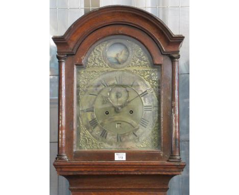 18th century oak eight day longcase clock, the arched brass dial with silvered Roman chapter ring and rocking ship pediment. 