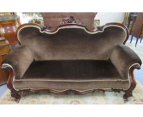 Victorian mahogany double ended show frame sofa , the shaped and carved back with scroll arms with carved ornate frieze, stan