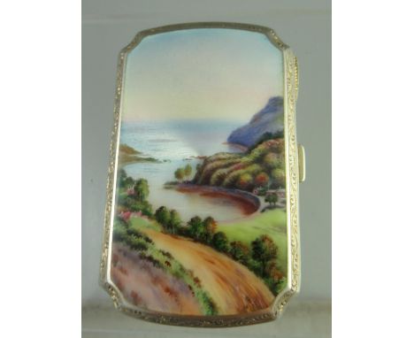 An early 20th century silver cigarette case of rectangular form with canted corners.  Decorated with Guilloche Enamel and han