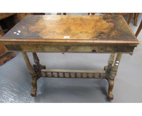 Victorian walnut rectangular fold over card table on end supports with gallery stretcher and out swept legs.(B.P. 21% + VAT) 