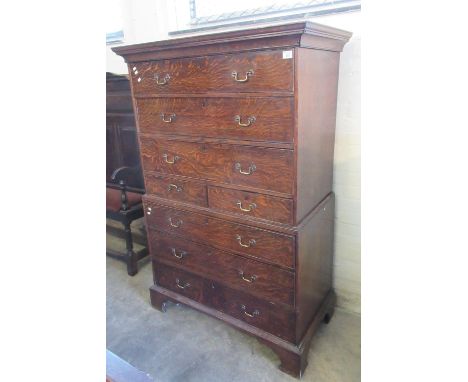 19th century oak chest on chest, the moulded cornice above three cock beaded long drawers and two smaller drawers. Projecting