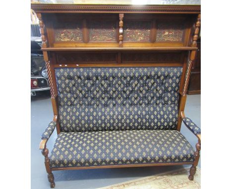 Edwardian mahogany high backed, upholstered hall settle having moulded dentil cornice above upper shelf with repoussé leather