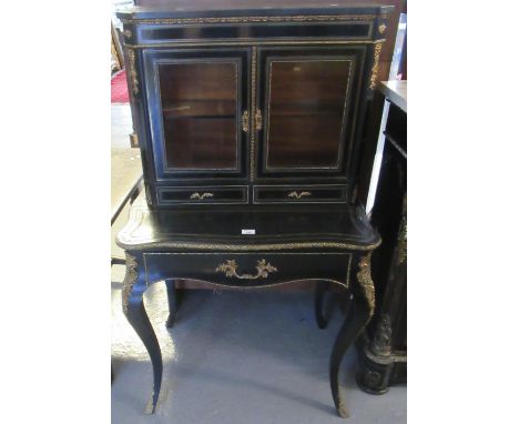 Victorian French design ebonised and gilded ladies two stage bonheur du jour, the shaped cornice above two glazed doors with 