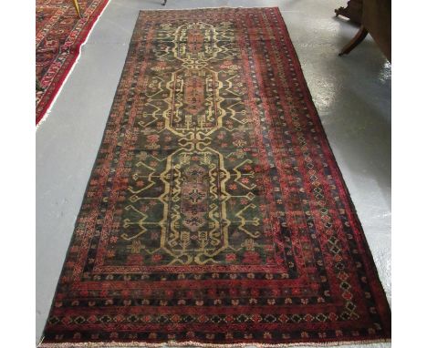 Old vintage Afghan Beluchi Nomadic carpet with unique stylised floral, foliate and geometric design. 314 x 134cm approximatel