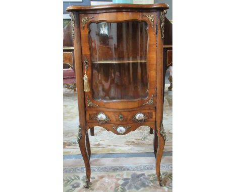 French design walnut pier or display cabinet, the moulded and shaped top above a single glazed door, the interior revealing o