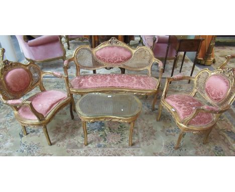 French design four-piece parlour suite to include two seater, kidney-shaped sofa and pair of matching chairs, all with cane b