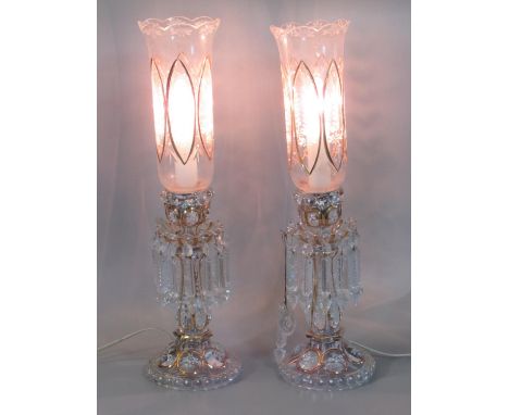Pair of Victorian bohemian clear glass lustre candle sticks, now converted to electricity, having tulip design shade with dro
