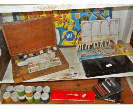 Shelf of artist's materials, inc. Reeves watercolour boxes, wooden artist's palette, etc.