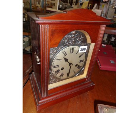 Mahogany cased mantle clock with arch topped dial, the movement chiming on a gong