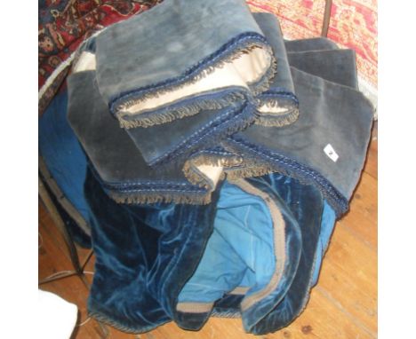 Pair of faded blue velvet curtains with matching pelmets
