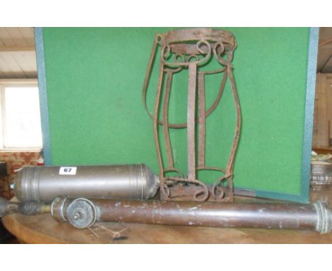 Old brass fire extinguisher, brass garden sprayer and wrought iron lantern