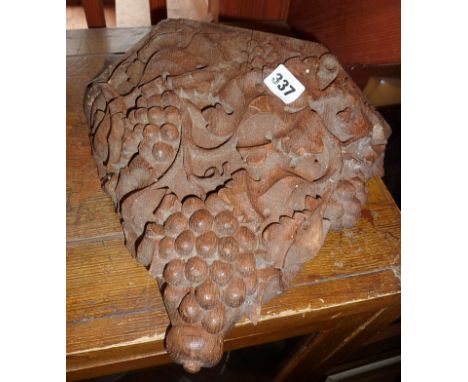 Carved wooden wall bracket decorated with vines and grapes
