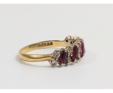 A Ruby and Diamond dress Ring. Set in hallmarked 18carat yellow gold. Size O. 3.69grams. 