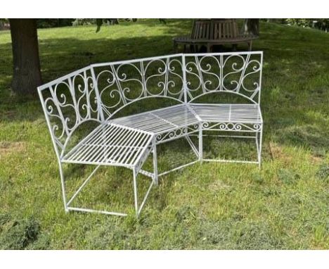 GARDEN BENCH, white painted wrought iron corner or bowed with scroll back and rail seat (in three sections), 180cm W. 