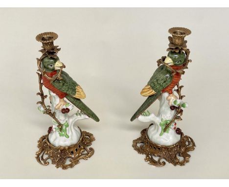 PARROT CANDLESTICKS, a pair, Continental style decorated porcelain and gilt metal mounted, 36cm H. (2) 
