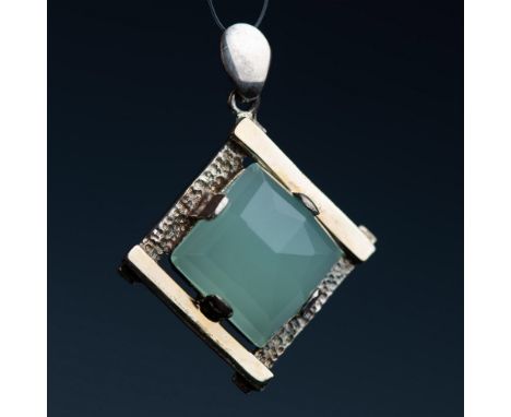 This beautiful pendant is 14k white gold with a faceted light green stone. It is marked 14k on the back. Total weight is appr