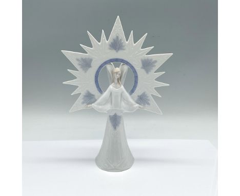 Glossy figure of an angelic angle with a many pointed star. White and blue colorations. Lladro backstamp. This item has its o